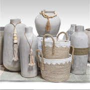 CARVED VASE WITH TASSEL